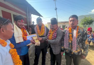 Badri Aryal being honored with a token of appreciation.