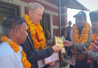 Anthony Peter Cox receiving a token of love.