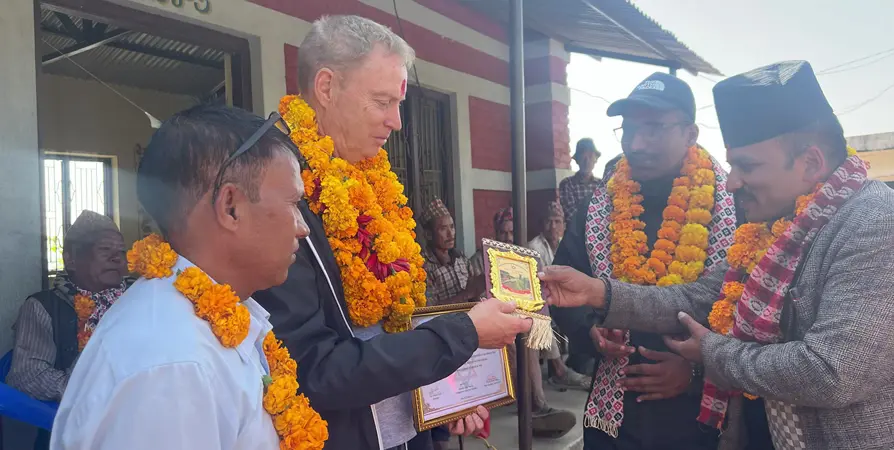 Anthony Peter Cox receiving a token of love.