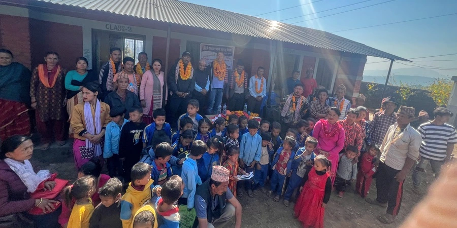 Students, teachers, and parents gather for a group photo